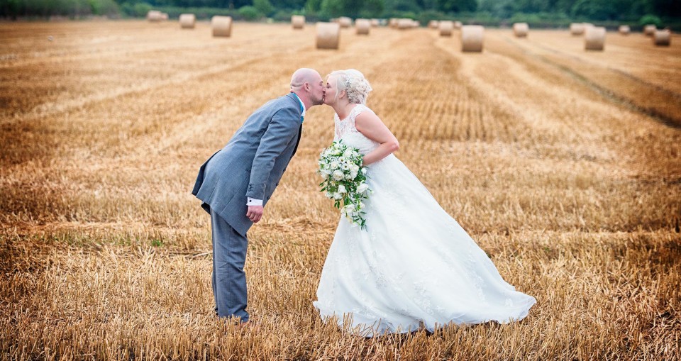 John Fretwell wedding photography in farmers field by Nottinghamshire photographer church ceremony in warsop
